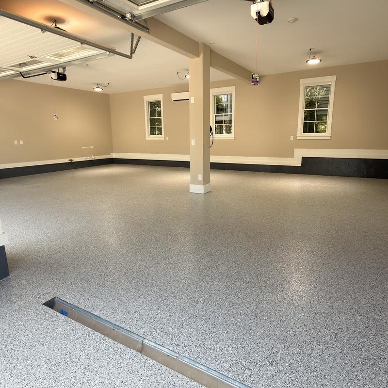 Finished garage with a light gray flake epoxy floor